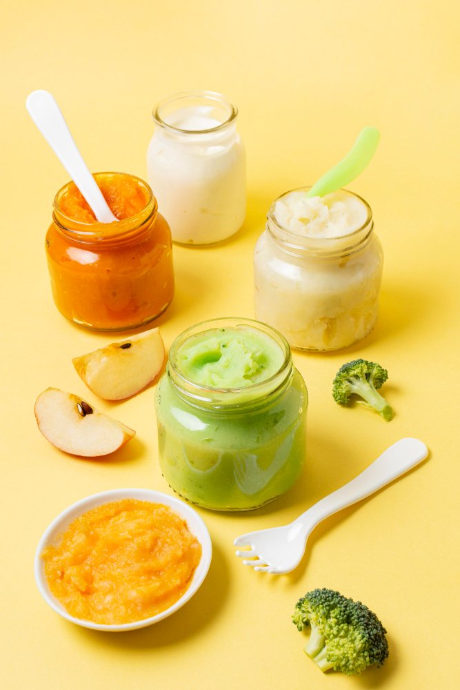 Assortment of mashed organic baby food in jars